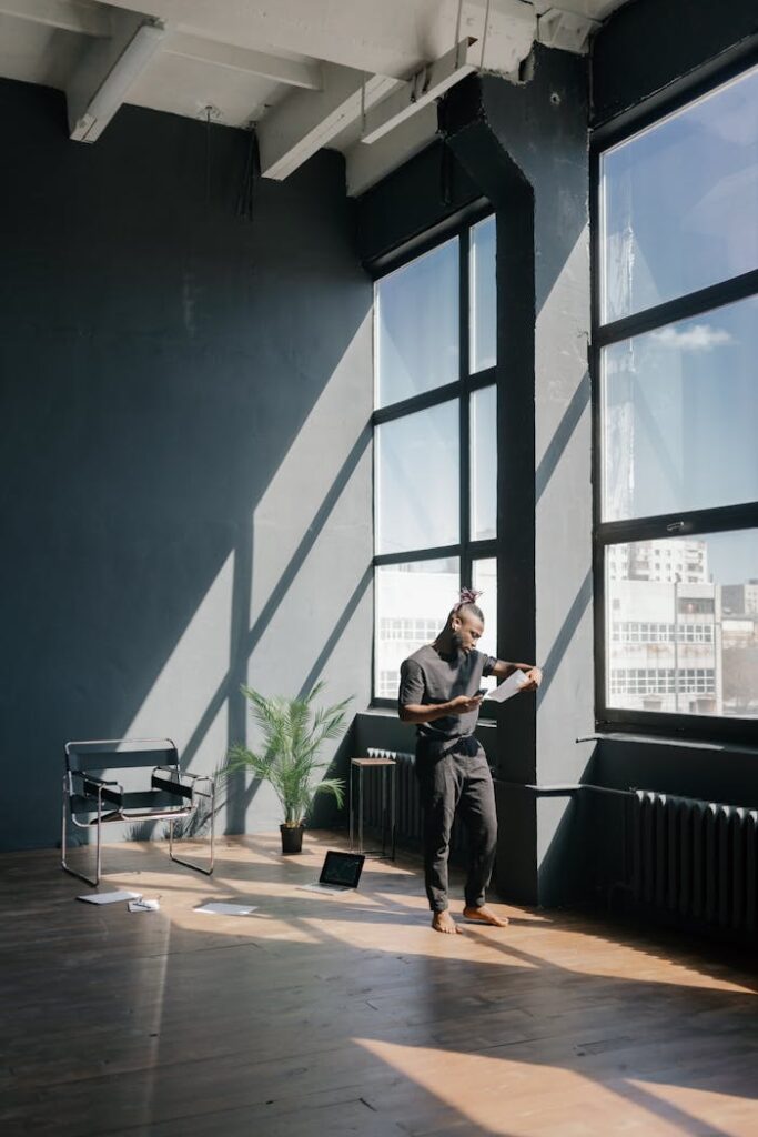 Man in Black Shirt Playing Guitar